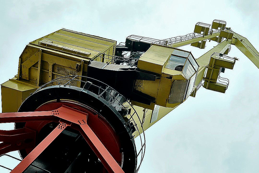 A low angle view of a large yellow crane