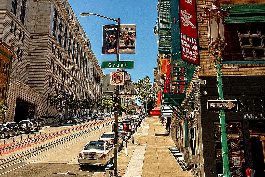 a street with cars and buildings