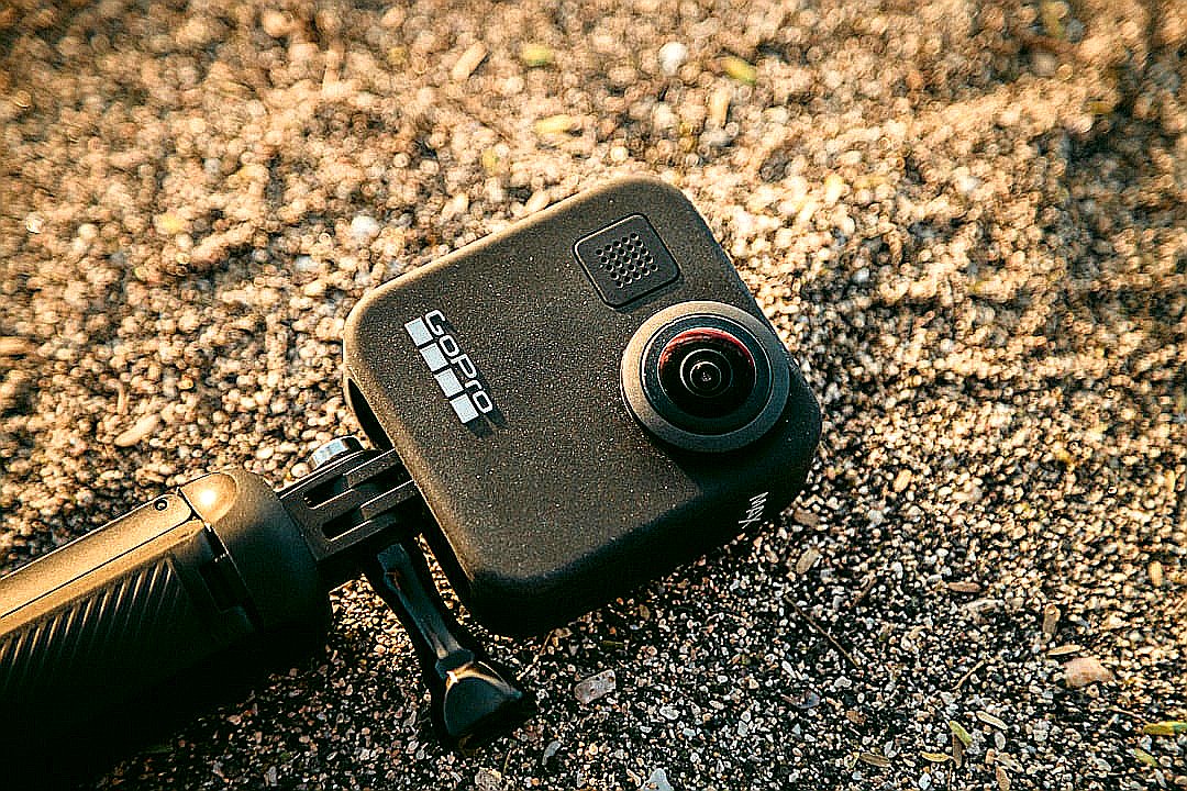 black GoPro action camera in the sand