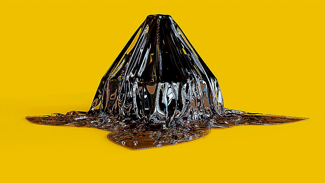 a black cone of plastic sitting on top of a yellow surface