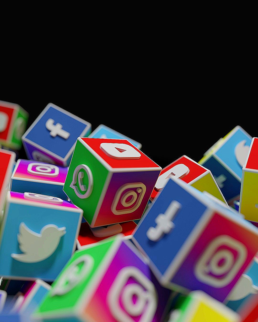 a pile of colorful blocks with social icons on them