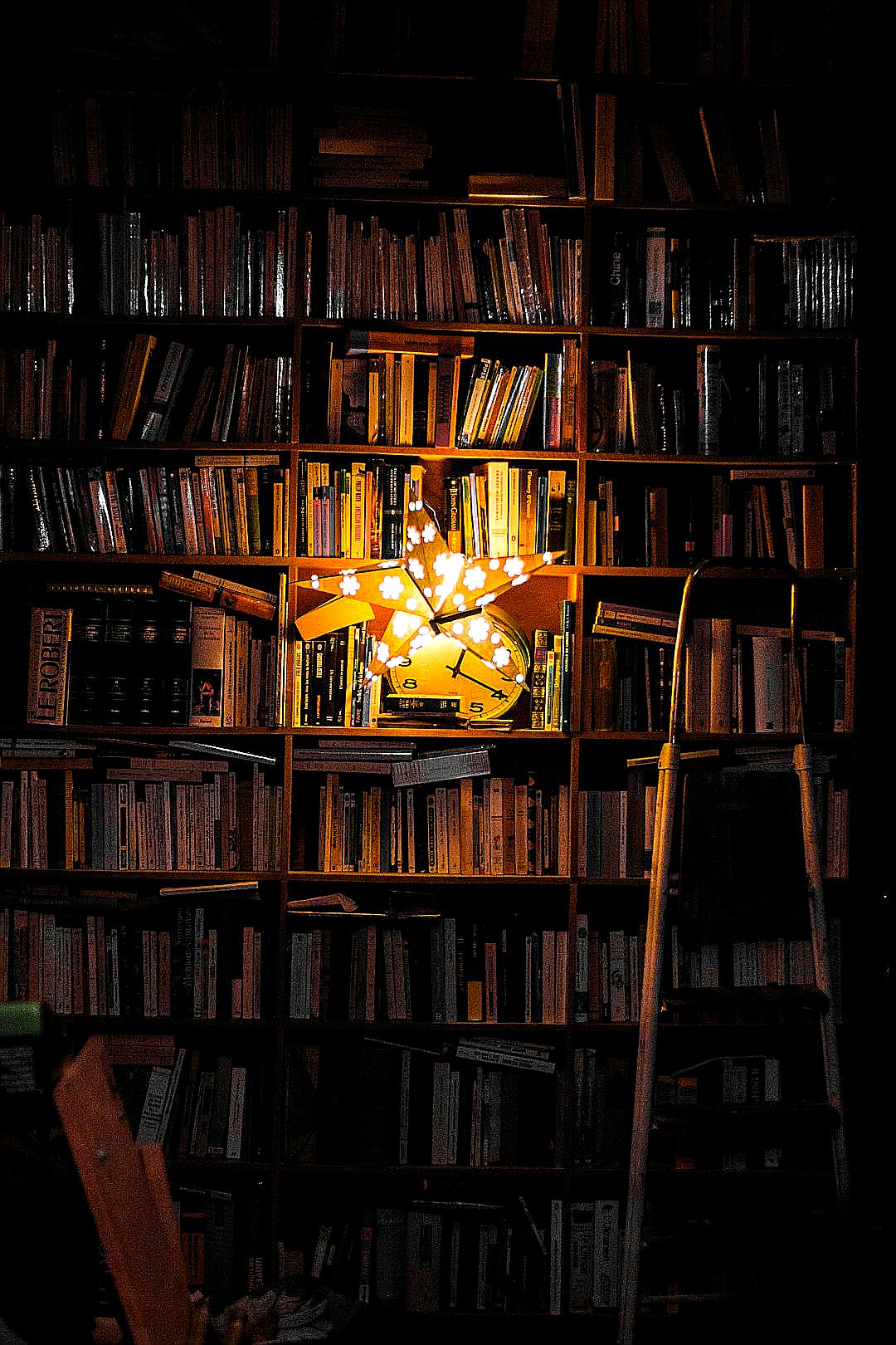 photography of bookshelf and star LED light decor