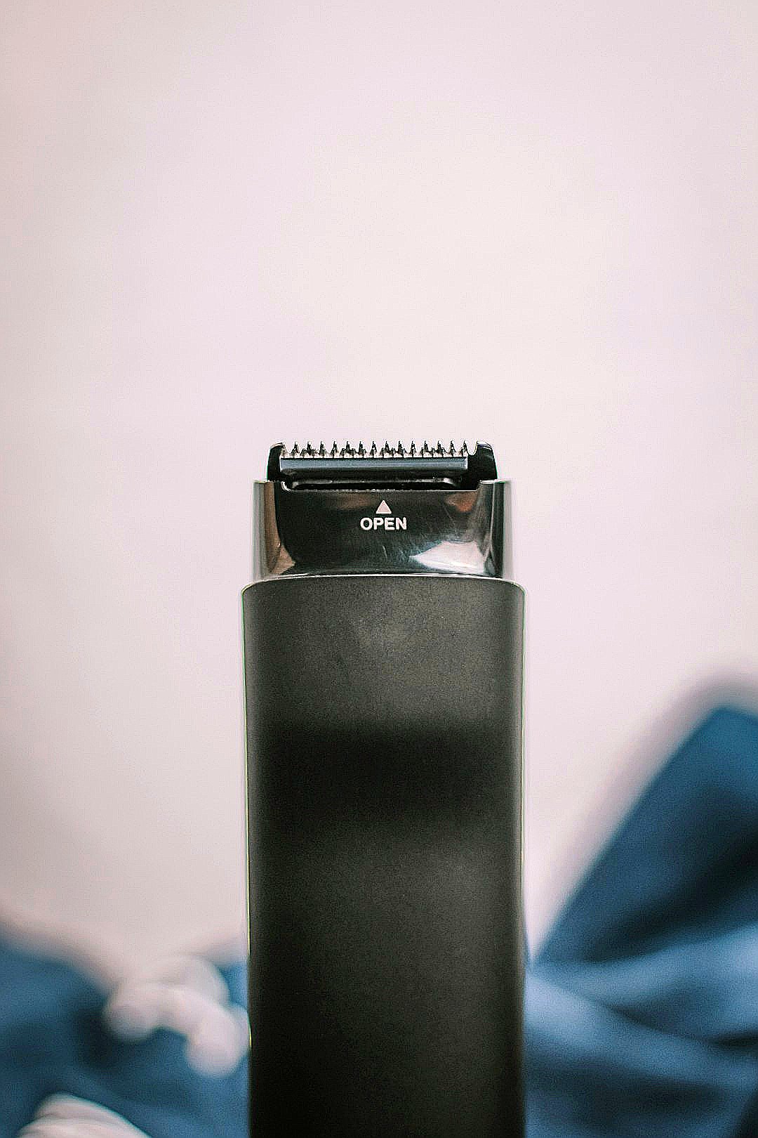 a close up of a hair dryer on a bed
