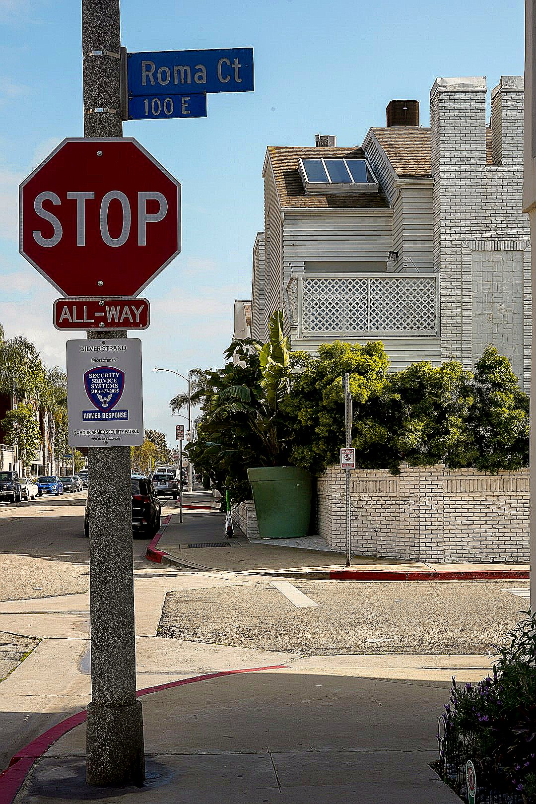 a red stop sign sitting on the side of a road