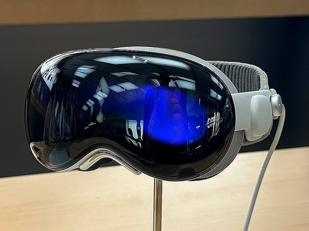 A pair of goggles sitting on top of a wooden table