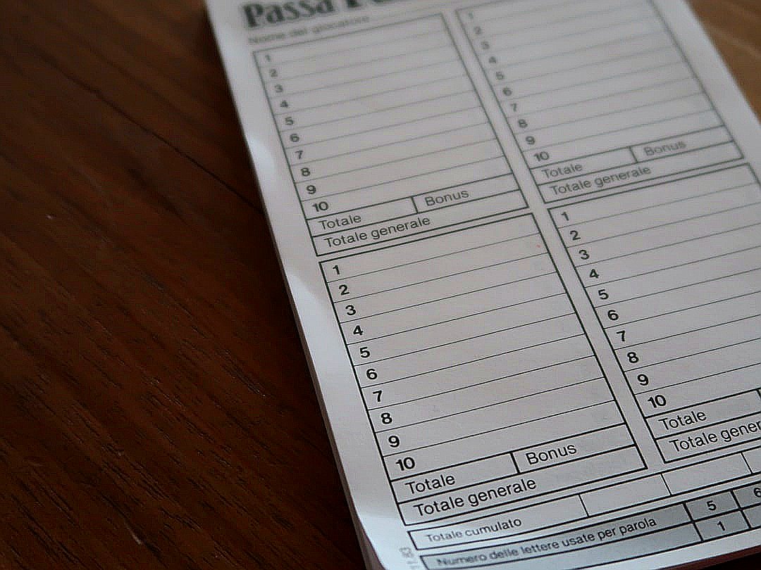 white paper document on brown wooden table