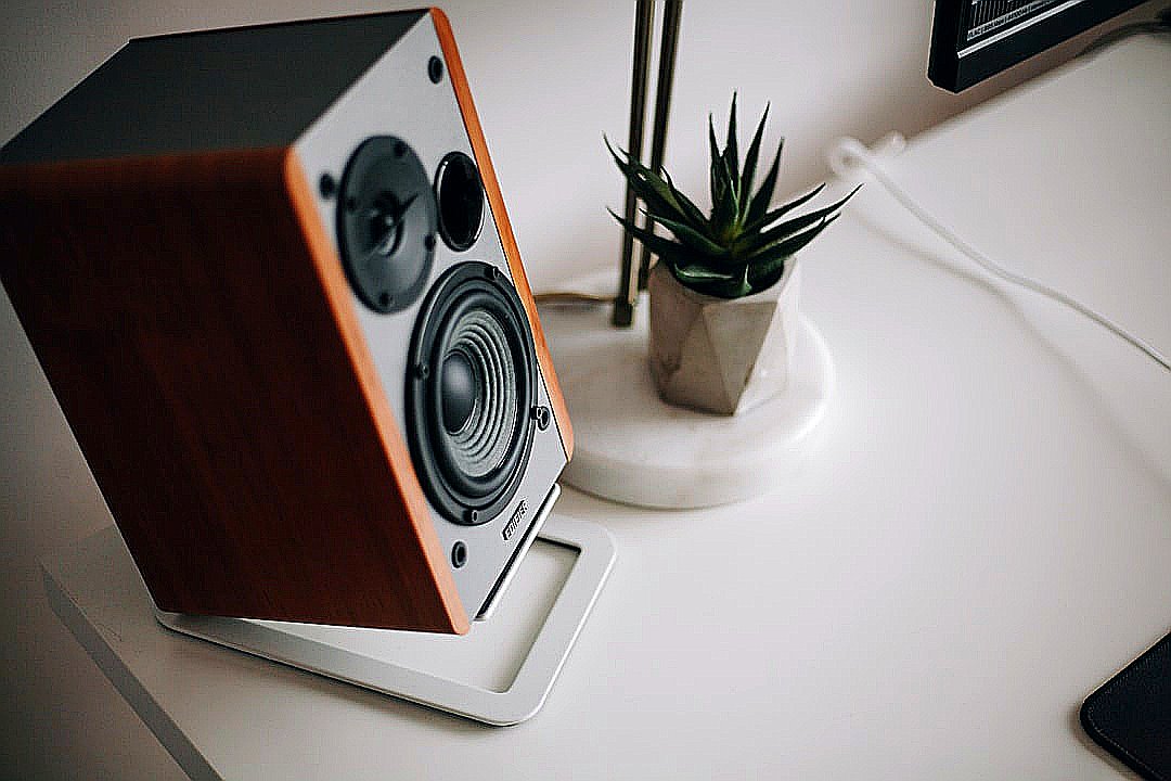 black and brown speaker on white table