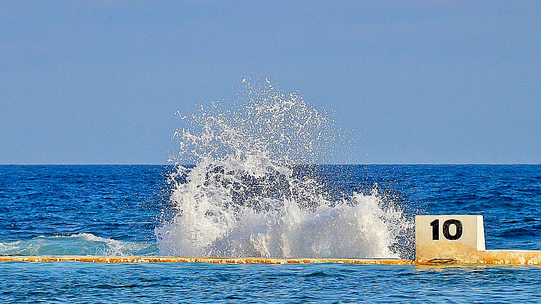 ocean waves under blue sky during daytime