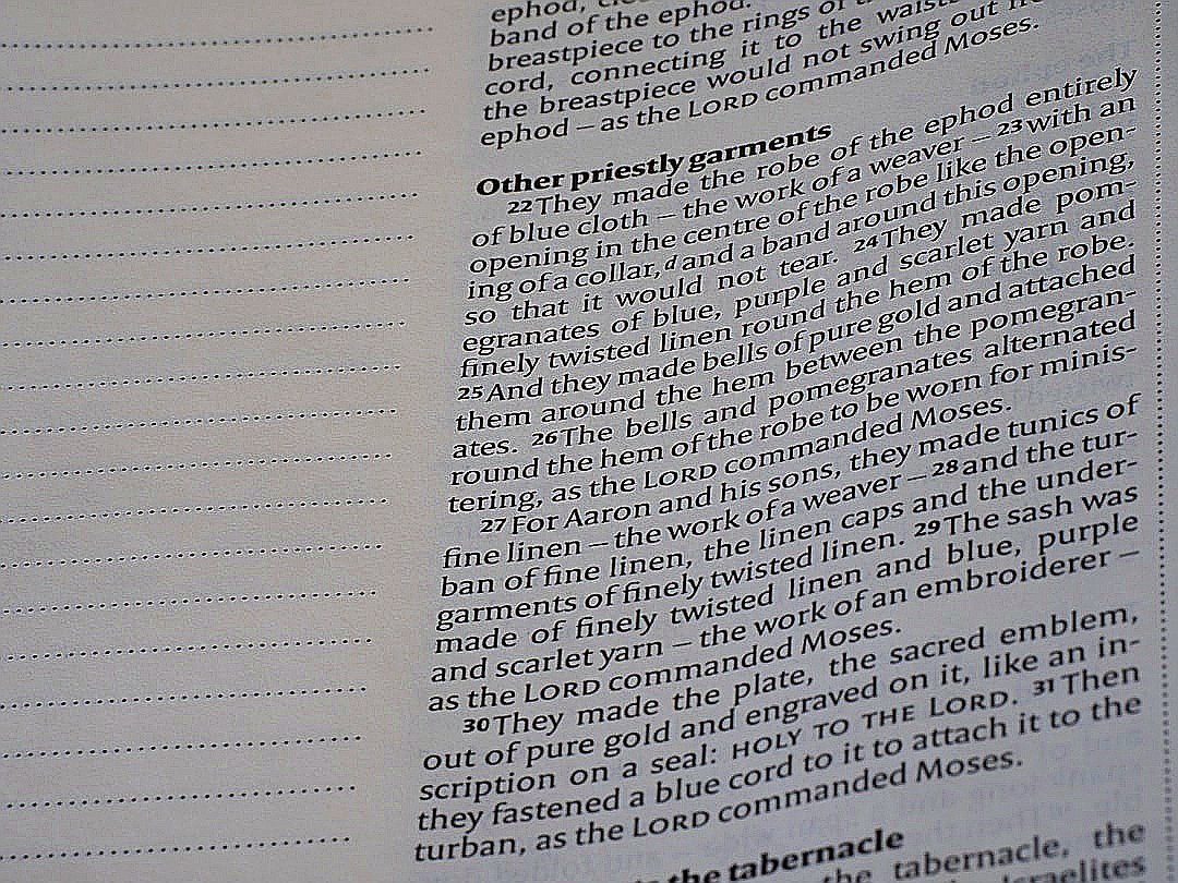 Close-up of an open book with text visible.