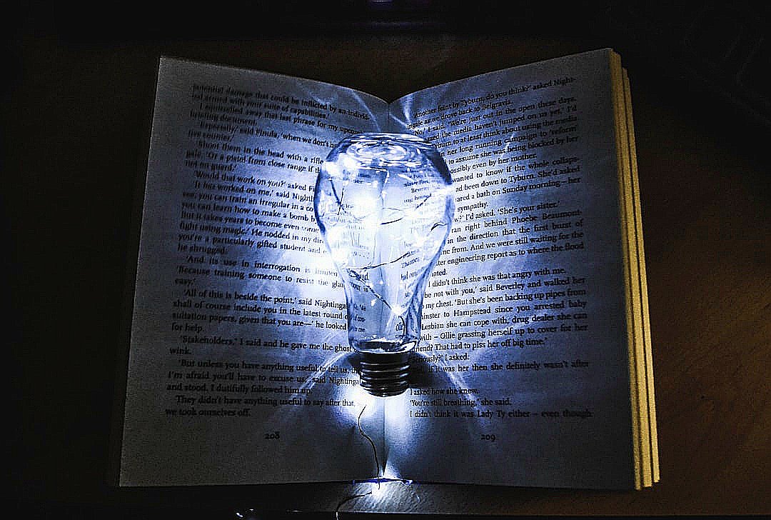 bulb with string lights on book page