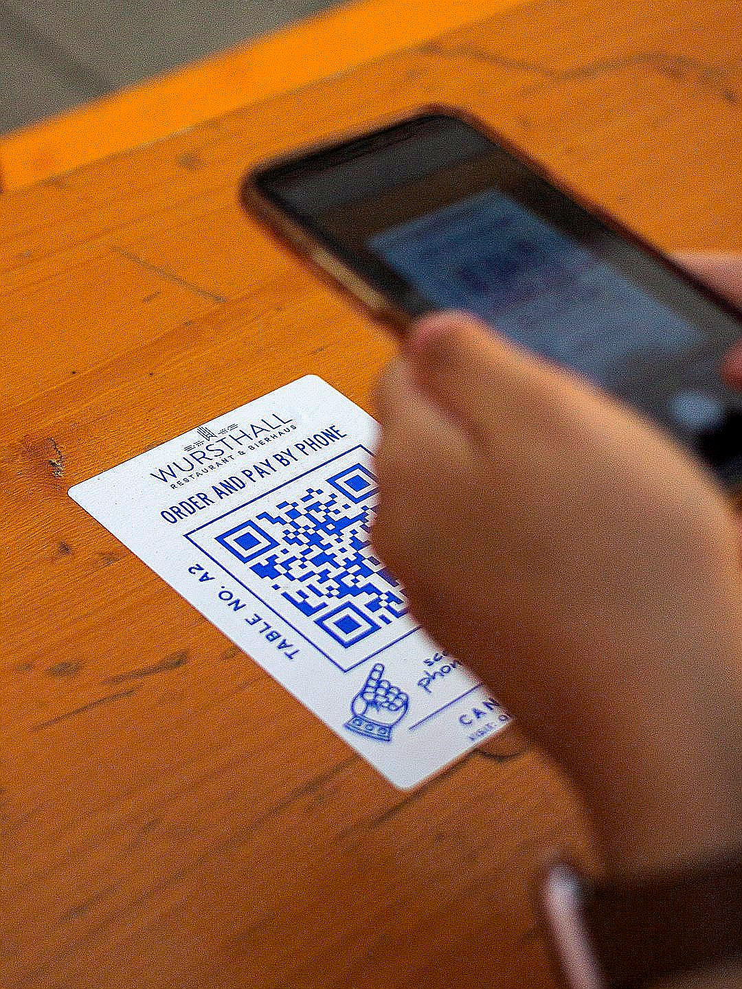 person holding white and black card