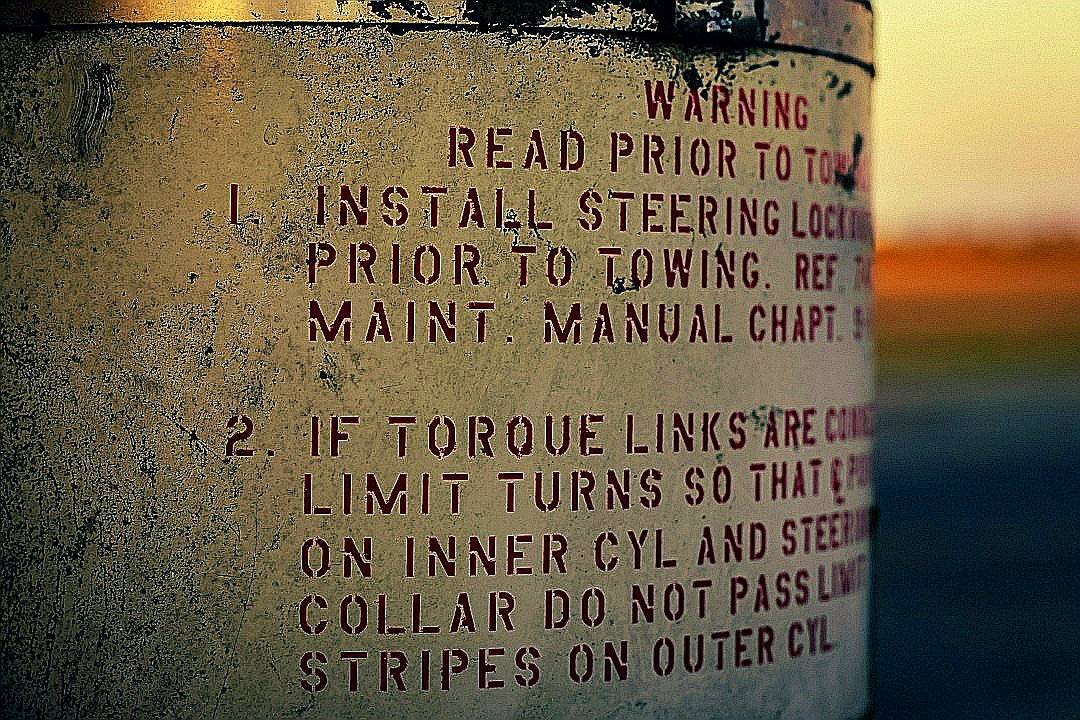 a close up of a sign on a pole