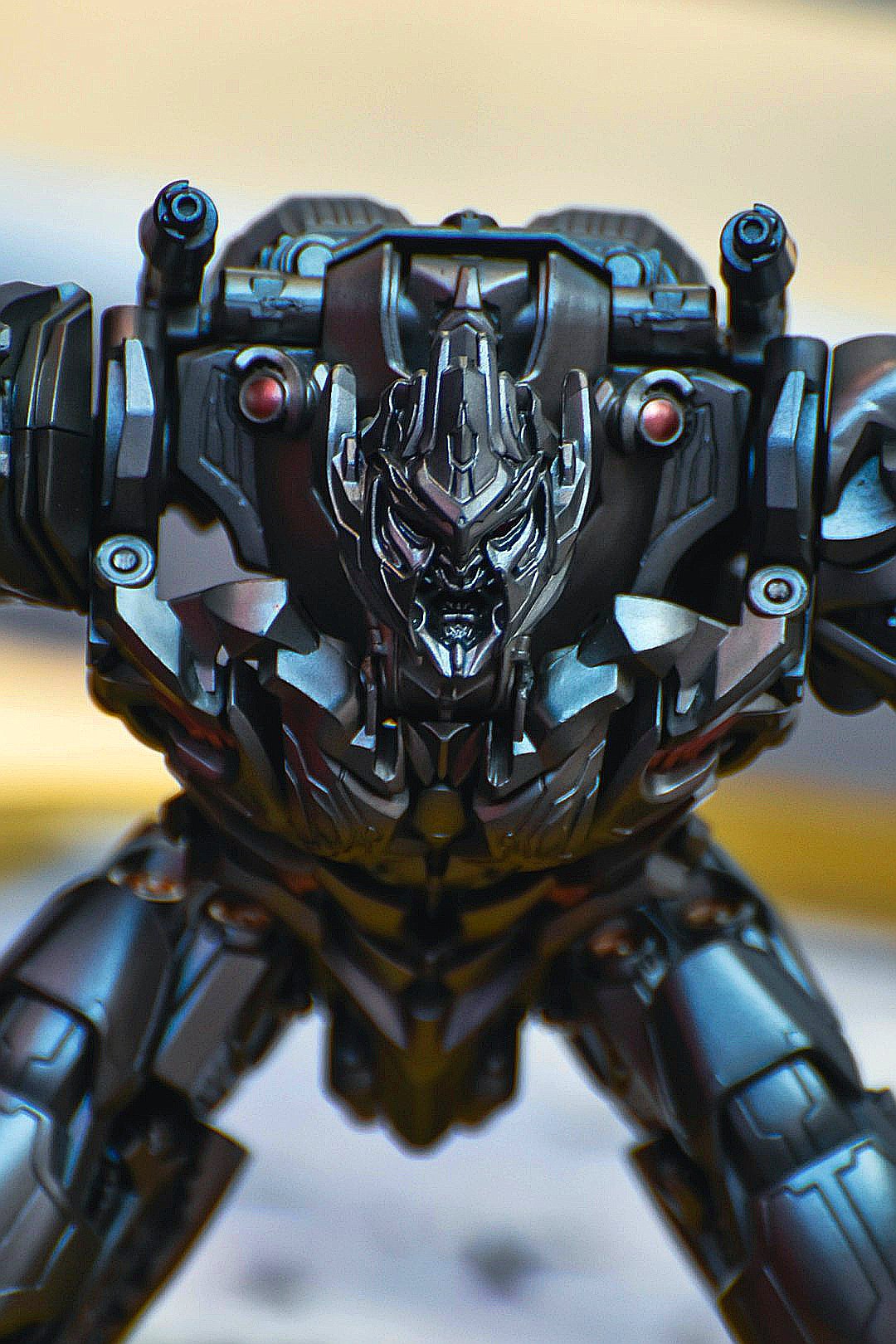 Close-up of a menacing black robot toy