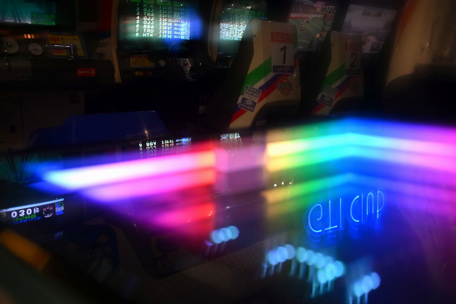 Blurred image of a neon arcade machine